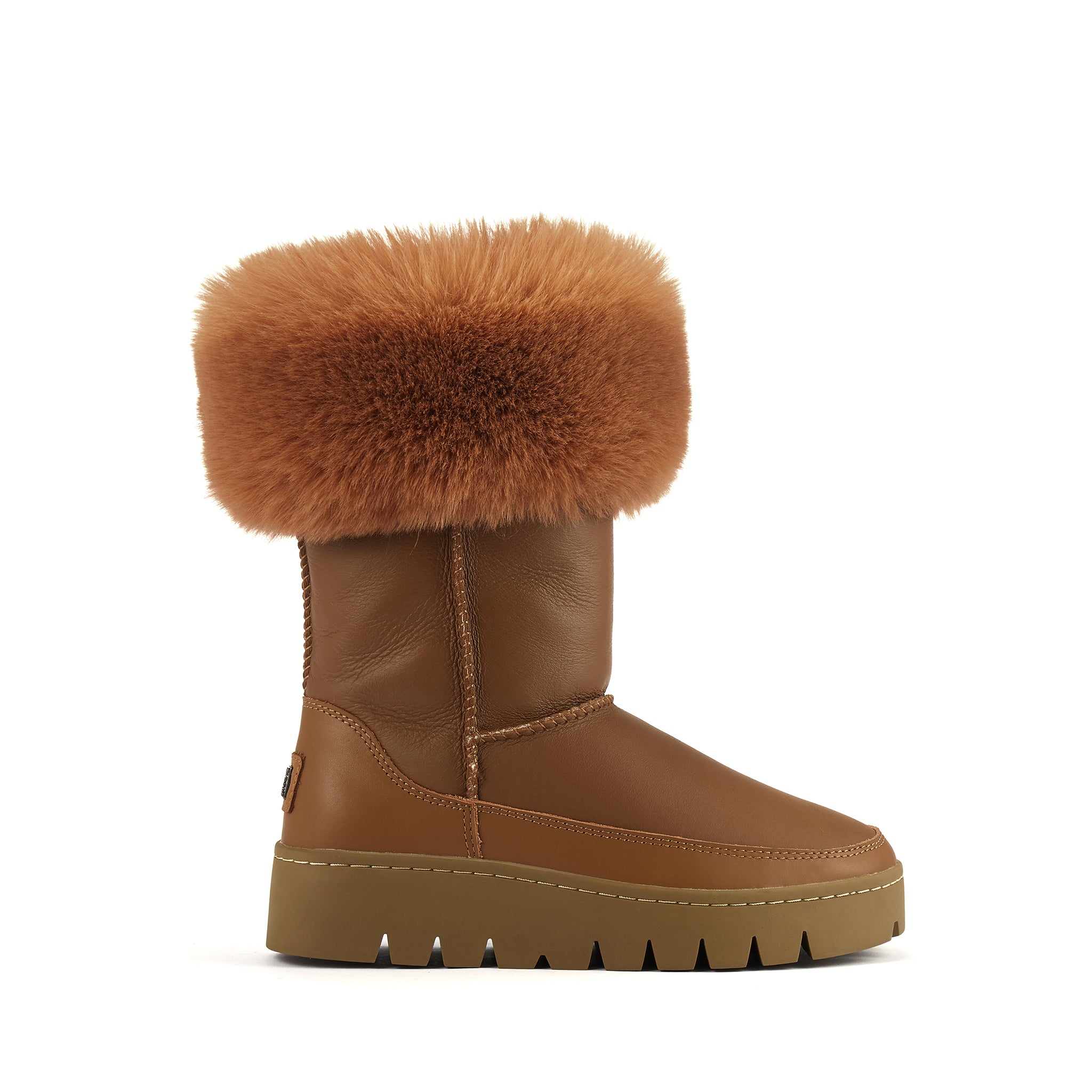 Mid calf height sheepskin fur lined pull on Winter boot with soft leather finish and Luxe faux fur cuff. Australia Luxe Collective